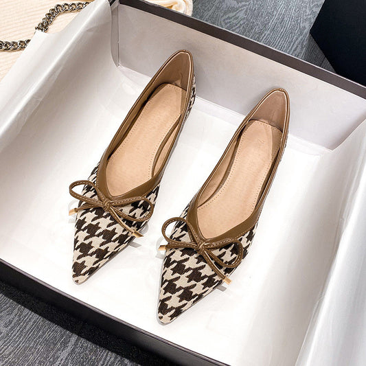 Elegant flat footwear with houndstooth print and bow details